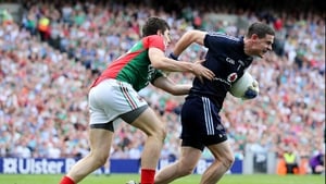 Alan Freeman gets to grips with Dublin goalkeeper Stephen Cluxton