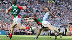 Dublin's Paul Flynn gets his shot away despite the best efforts of Lee Keegan
