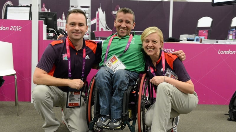 John Fulham poses with London 2012 volunteers