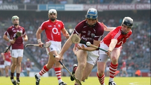 David Collins fights for possession with Shane O'Neill of Cork
