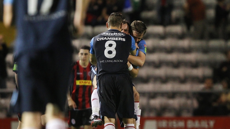 St Pat's celebrate the winning goal - a strike that keeps them in the title hunt