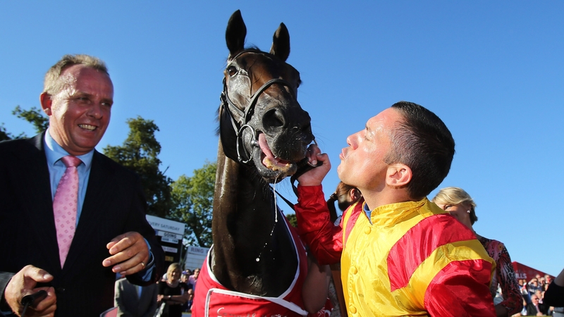 Jockey Frankie Dettori celebrates with Snow Fairy in the parade ring