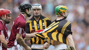Galway's David Collins holds onto the jersey of Kilkenny's Richie Power