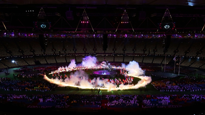A heart of flames is displayed on the arena floor during the closing ceremony