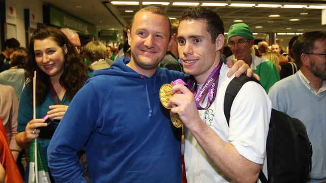 Comedian PJ Gallagher with sprinter Jason Smyth.