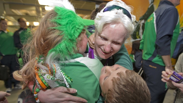 Cyclist Catherine Walsh is welcomed home by her children.