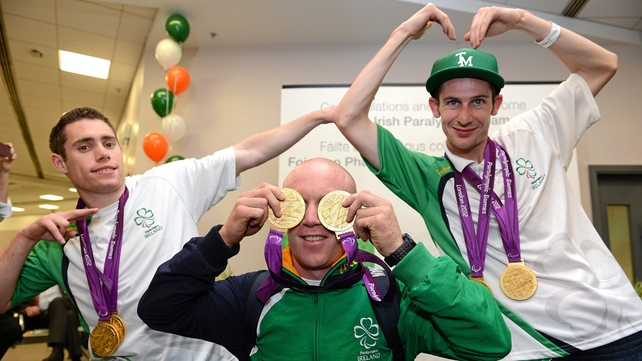 Jason Smyth, Mark Rohan and Michael McKillop show off their medals as the Irish team returns to Dublin