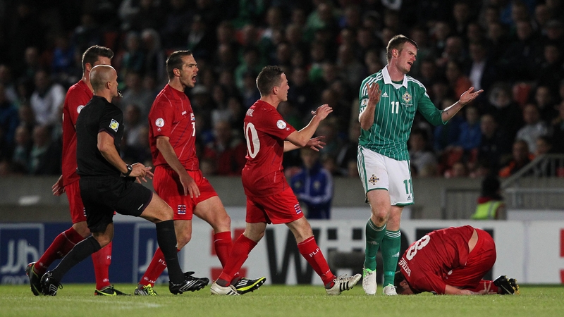 Chris Brunt reacts after fouling Gilles Bettmer of Luxembourg