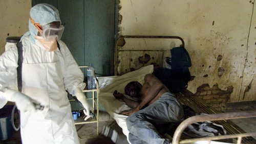 This photo, taken in March 2003, shows an agent of the Congolese Red Cross disinfecting a room at a hospital