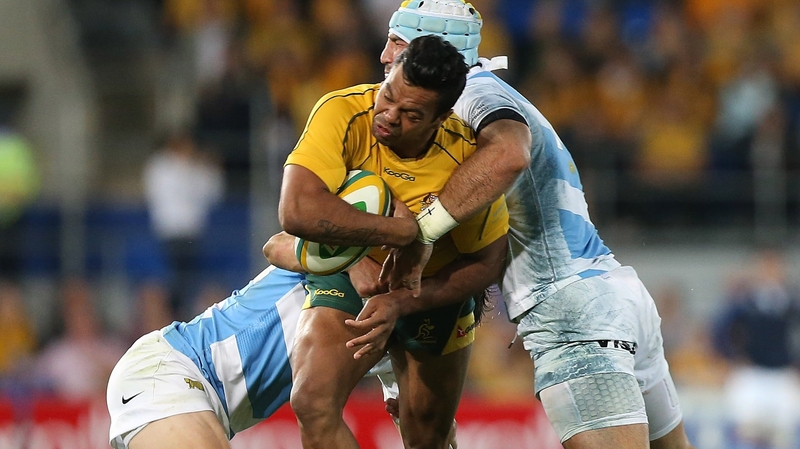 Kurtley Beale crashes into the Argentine defence