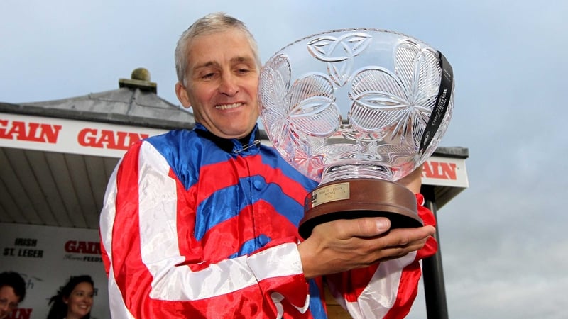 Niall McCullagh celebrates with the trophy after winning the Leger
