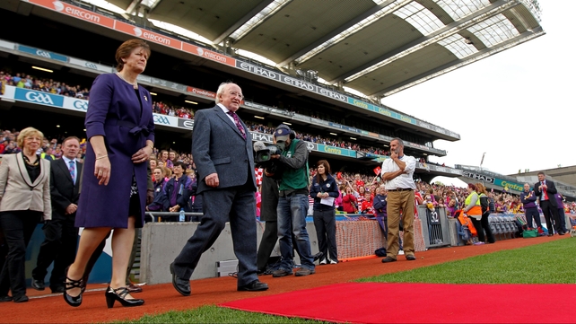President of the Camogie Association Aileen Lawlor (l) and President of Ireland Michael D Higgins walk out to meet the teams before the Senior final