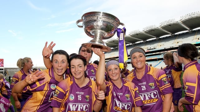 The Wexford players celebrate with the O'Duffy Cup