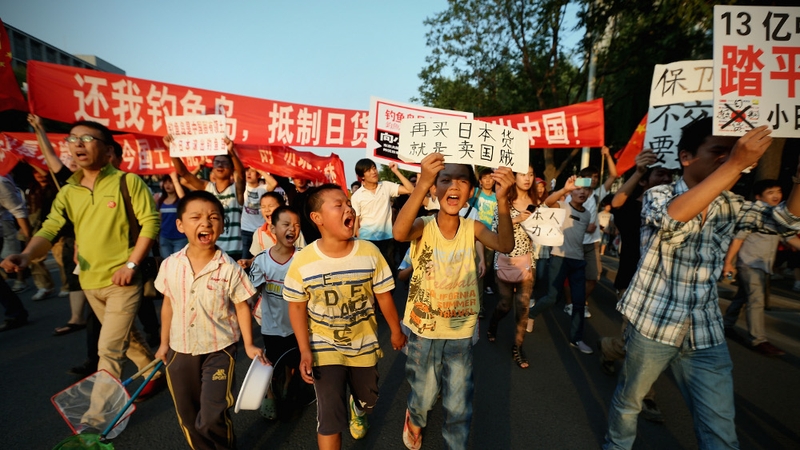 Chinese protesters stage an anti-Japan rally outside the Japan Embassy yesterday