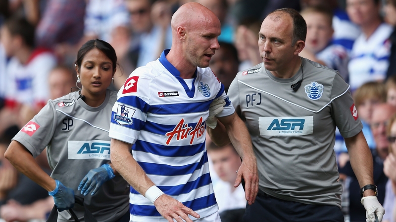 Johnson leaving the field of play at Loftus Road
