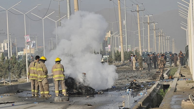A suicide bomber blew herself up alongside a minivan on a major highway leading to the international airport