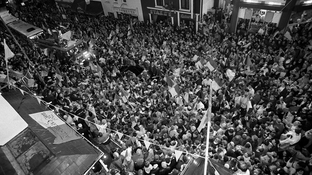 Fans gather in the streets to catch a glimpse of their heroes