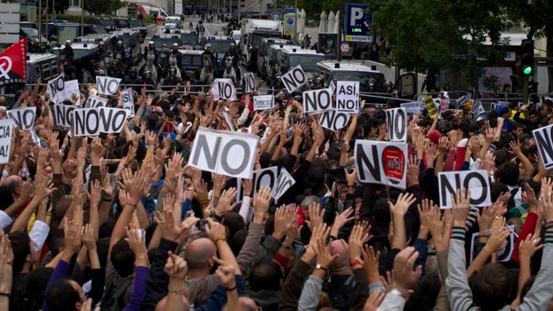 Protesters were surrounded by barricades, police trucks and more than 1,500 police in riot gear