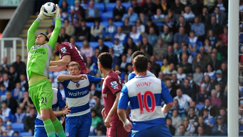 Reading goalkeeper Alex McCarthy claims the ball