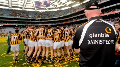Brian Cody watches on as his players celebrate victory in the 2012 All-Ireland final