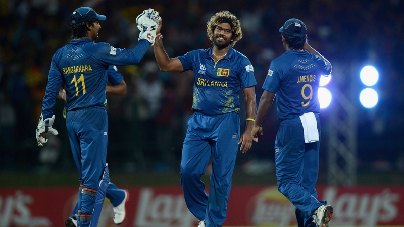 Lasith Malinga of Sri Lanka celebrates with Kumar Sangakkara and Jeevan Mendis after bowling out Samit Patel of England