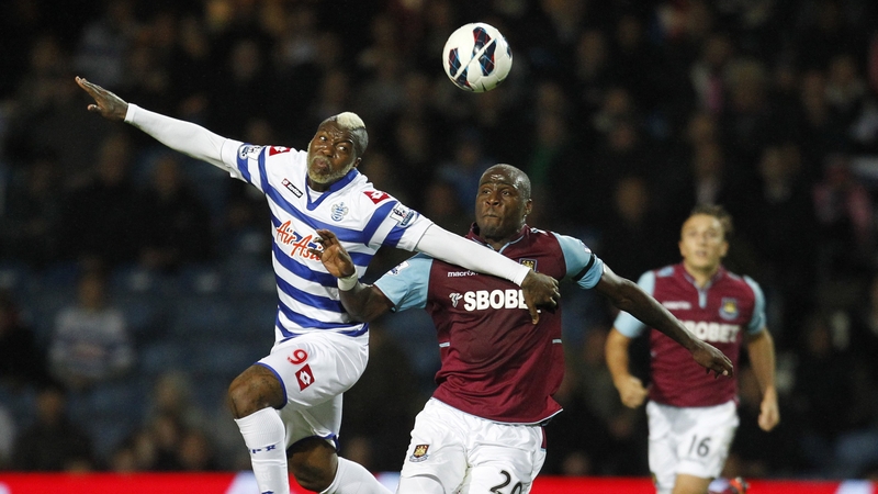 Queens Park Rangers' Djibril Cisse (left) vies with West Ham United's Guy Demel
