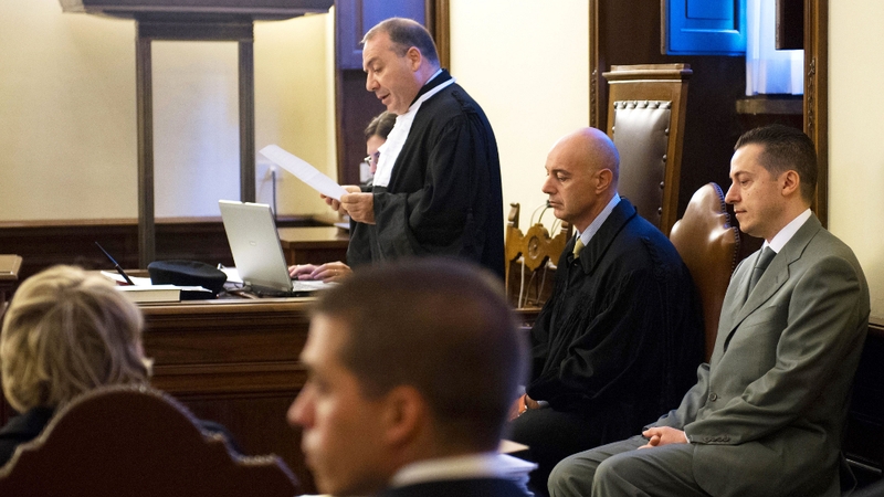 Pope Benedict XVI's former butler Paolo Gabriele (R) at the opening session of his trial
