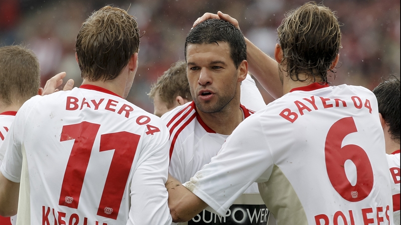 Michael Ballack celebrates a goal with Stefan Kiessling (l) and Leverkusen's midfielder Simon Rolfes during his final game last May