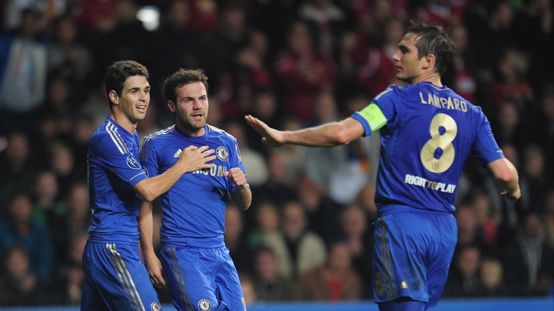 Juan Mata of Chelsea (centre) celebrates scoring one of his two goals with team-mates Oscar and Frank Lampard