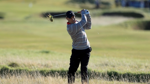 Oscar Pistorius of South Africa plays out from the rough on the fourth hole at Carnoustie