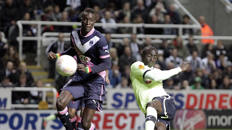 Newcastle United's striker Papiss Cisse (r) scores his goal against Bordeaux
