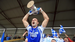 St Patrick's Darragh O'Sullivan lifts the trophy after their 1-12 to 0-14 win over Baltinglass in the Wicklow football final