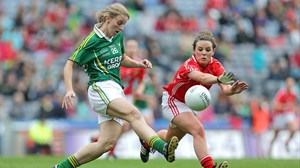 Cork's Orlagh Farmer attempts to block down Margaret Fitzgerald of Kerry