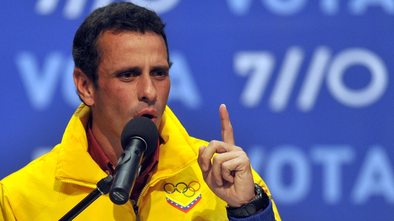 Henrique Capriles speaks to supporters after receiving news of his defeat in Caracas