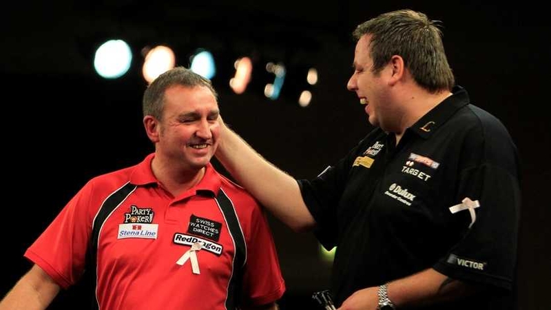 Adrian Lewis (R) saw off Richie Burnett (L)
