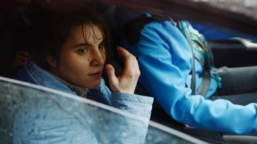 Yekaterina Samutsevich sits in a car outside the Moscow court after being released