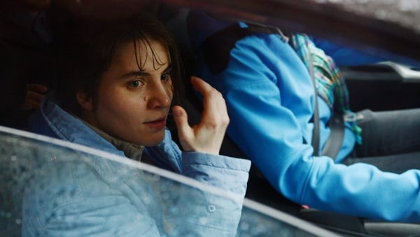Yekaterina Samutsevich sits in a car outside the Moscow court after being released