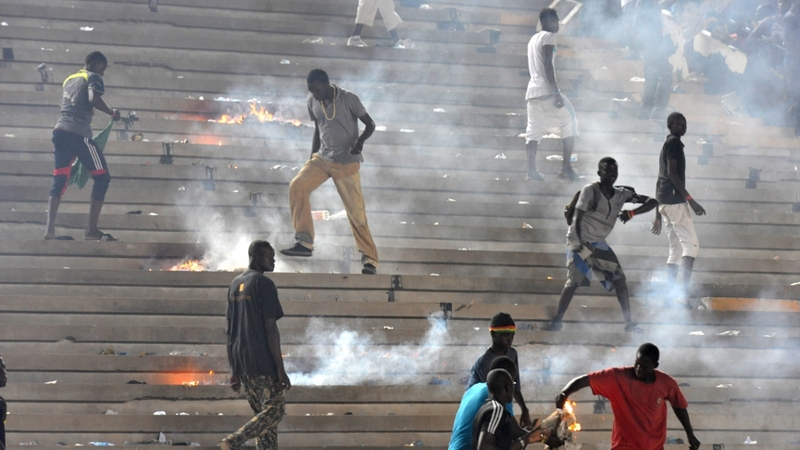 Fans lit fires in the terraces, which led to the match being abandoned