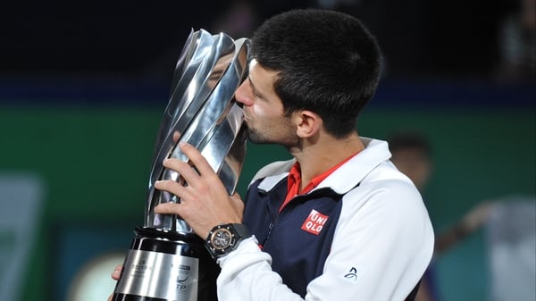 Novak Djokovic kisses the Shanghai Masters trophy