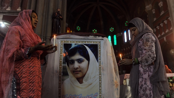 Pakistani Christians attend a mass praying for Malala Yousafzai