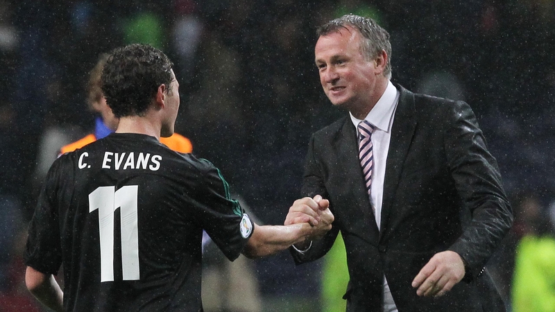 Northern Ireland's Corry Evans, and manager Michael O'Neill, celebrate holding Portugal to a draw