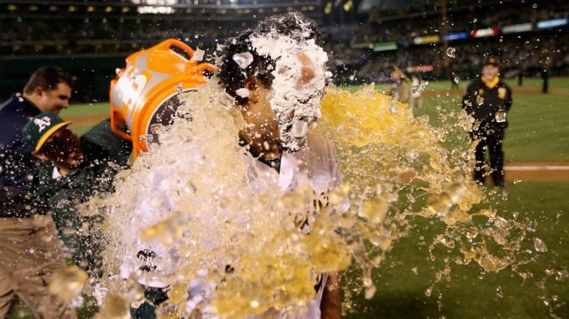 Coco Crisp of the Oakland Athletics is soaked after hitting a game-winning single to beat the Detroit Tigers in October