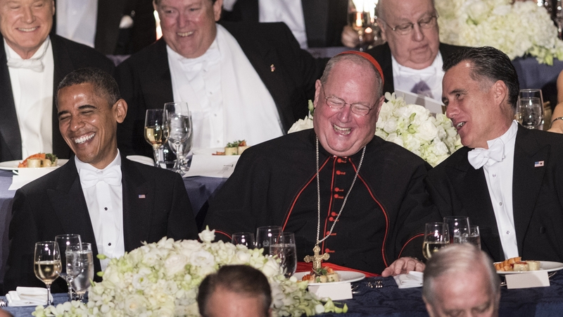 US President Barack Obama, Cardinal Timothy Dolan, Archbishop of New York, and Republican presidential candidate Mitt Romney during the 67th annual Al Smith dinner