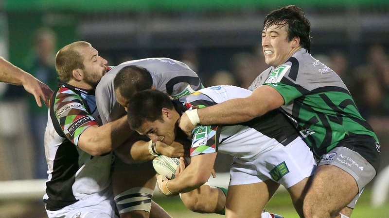 Dennis Buckley of Connacht attempts to tackle Harlequins' Ben Botica