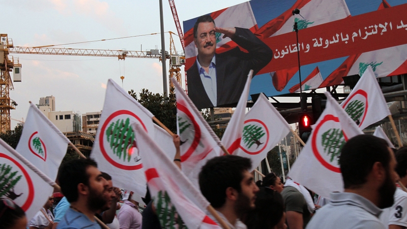 March 14 supporters take part in a protest after Friday's car bomb