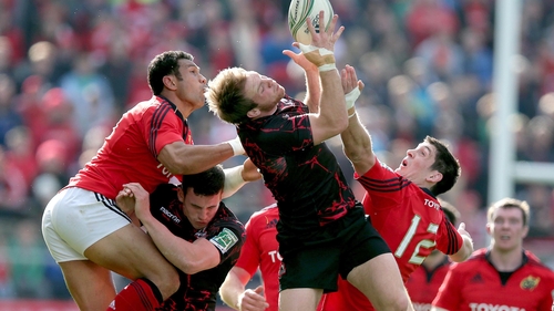 Munster's Casey Laulala and James Downey with Greig Tonks of Edinburgh