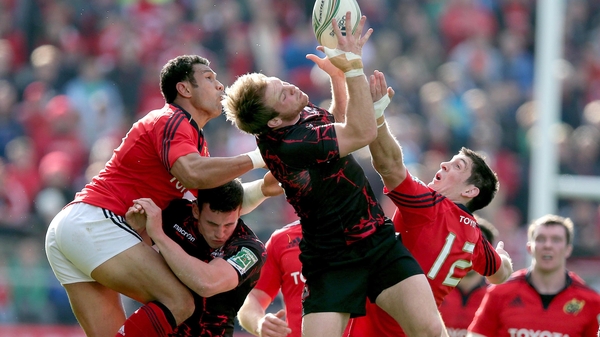 Munster's Casey Laulala and James Downey with Greig Tonks of Edinburgh