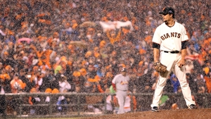 Javier Lopez pitches through the rain for the San Francisco Giants - the Giants went on to win the World Series