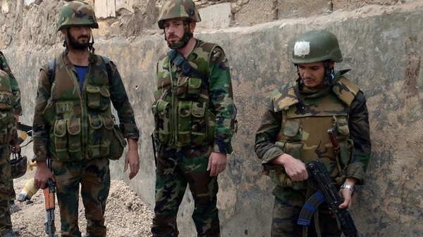Syrian soldiers are trying to push rebels from key positions in Damascus