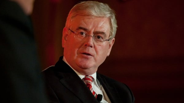 Eamon Gilmore said €16m of Irish Aid payments have been put on hold following the revelations